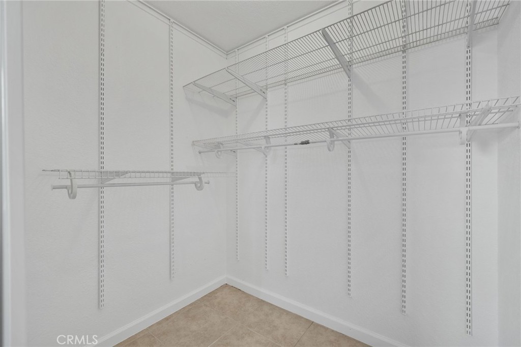 9846 Sunny Vista Road Phelan, CA 92371 - Photo 17 of 34 a view of a room with racks on the wall