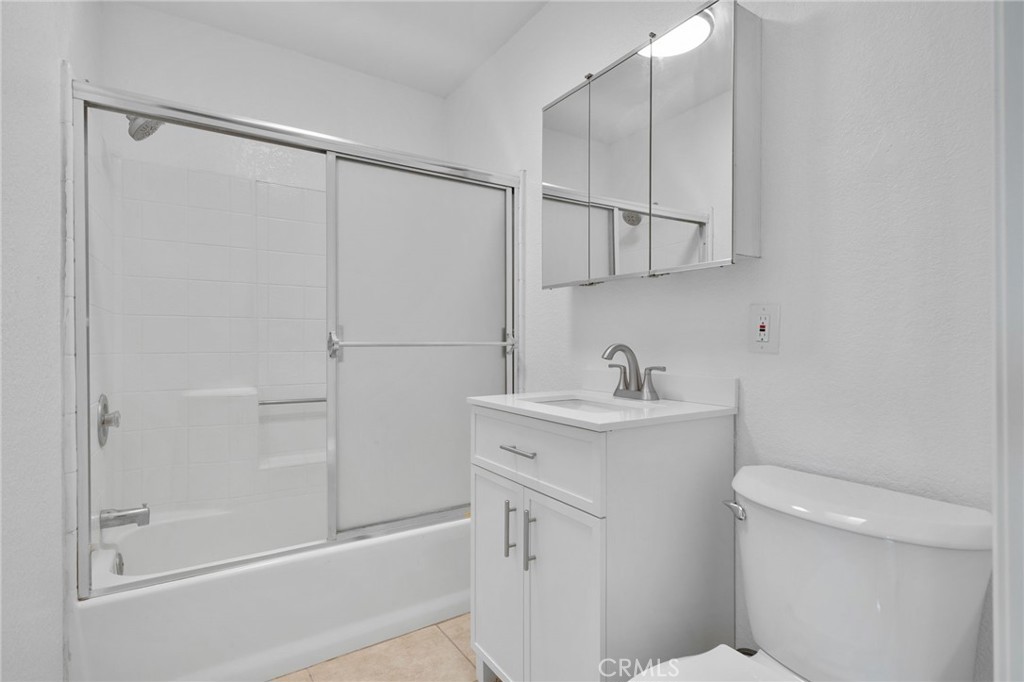 9846 Sunny Vista Road Phelan, CA 92371 - Photo 22 of 34 a bathroom with a sink a toilet and vanity