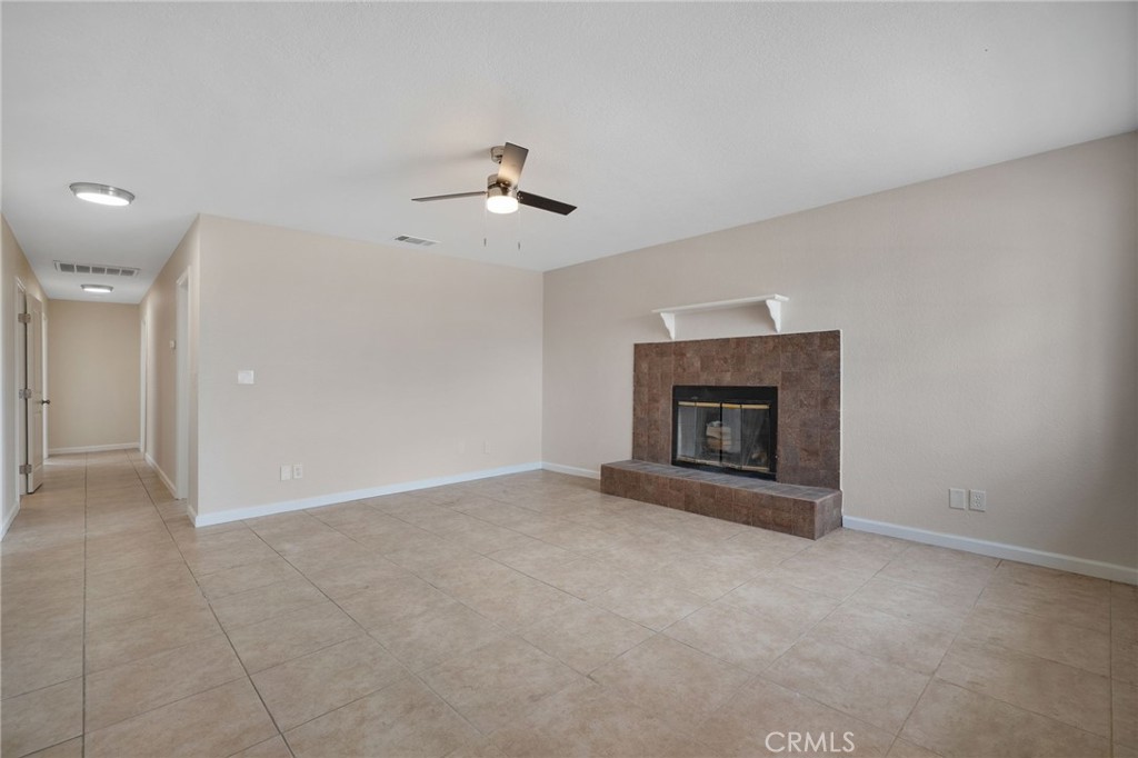 9846 Sunny Vista Road Phelan, CA 92371 - Photo 4 of 34 a view of an empty room with a fireplace