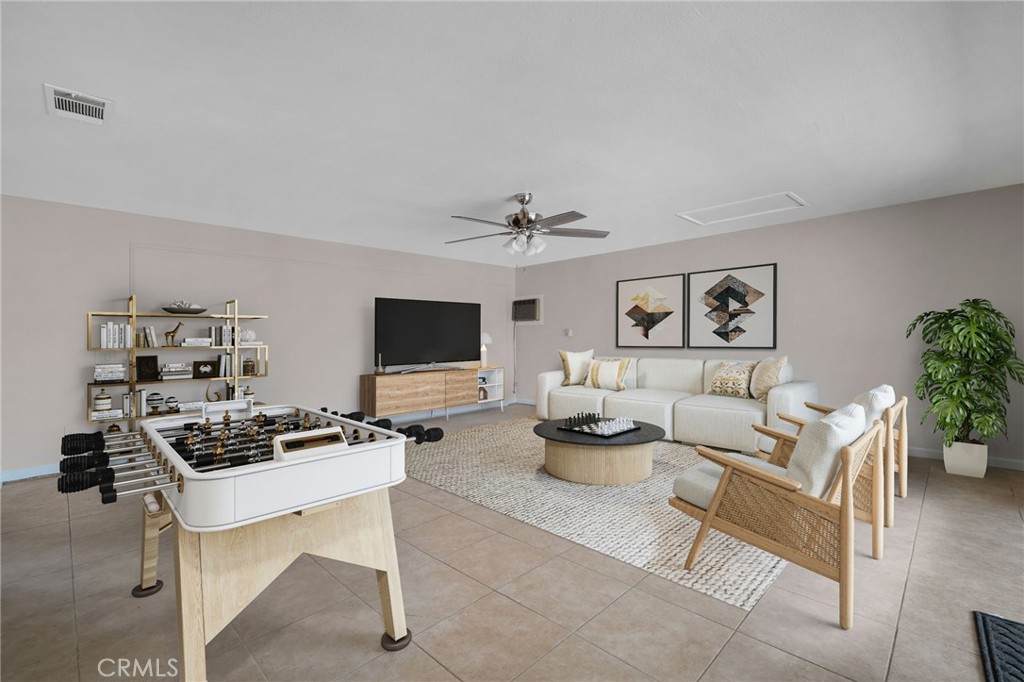 9846 Sunny Vista Road Phelan, CA 92371 - Photo 5 of 34 a living room with furniture and a flat screen tv