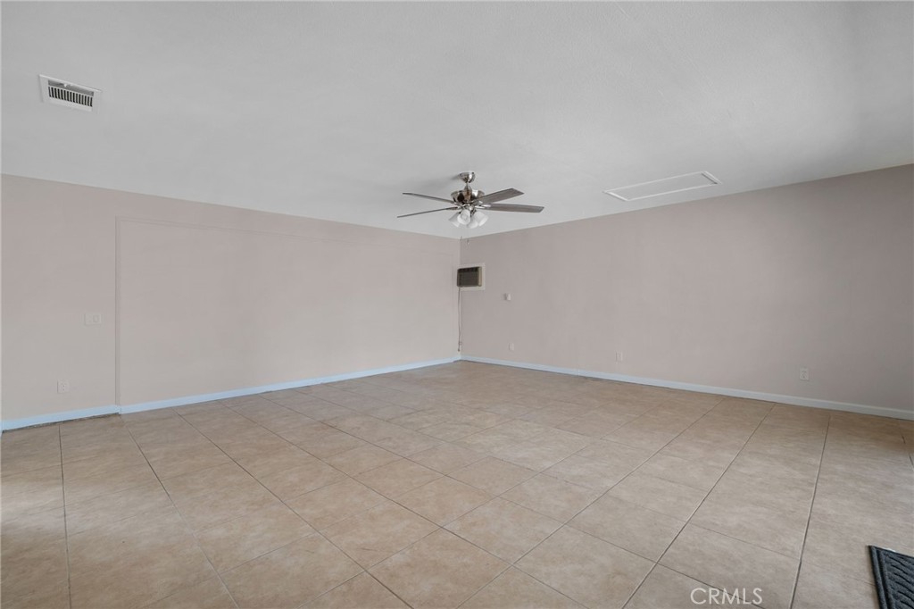 9846 Sunny Vista Road Phelan, CA 92371 - Photo 6 of 34 a view of a room with a ceiling fan and a ceiling fan