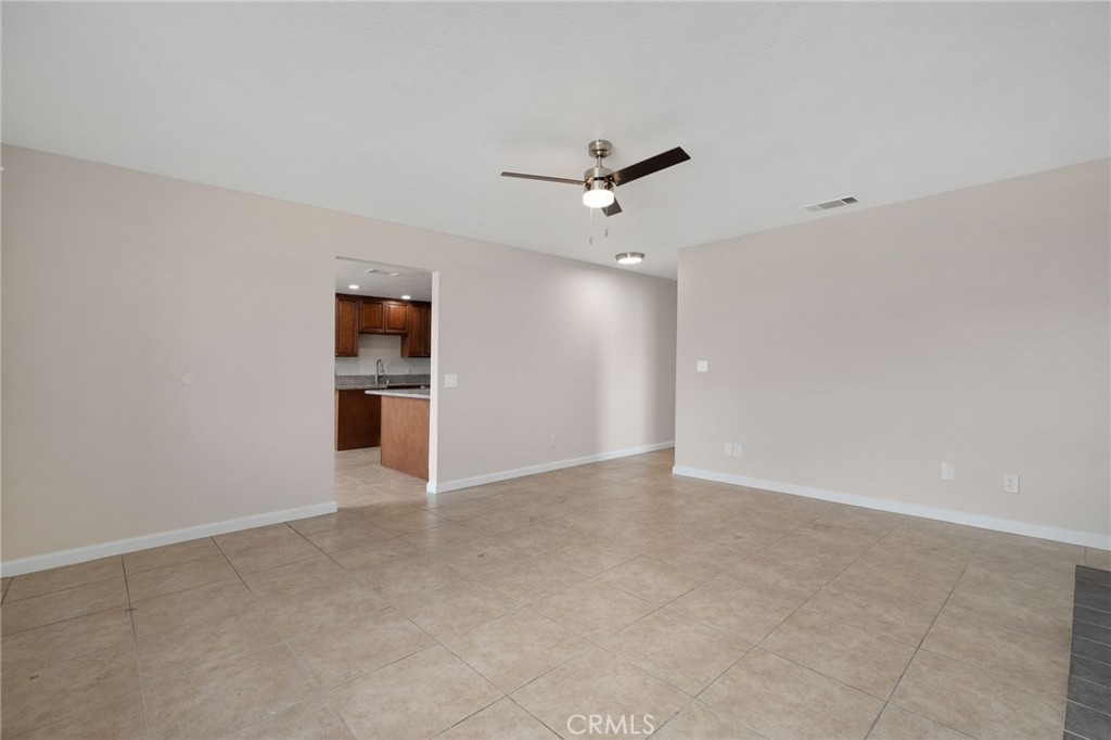 9846 Sunny Vista Road Phelan, CA 92371 - Photo 9 of 34 an empty room with closet and windows