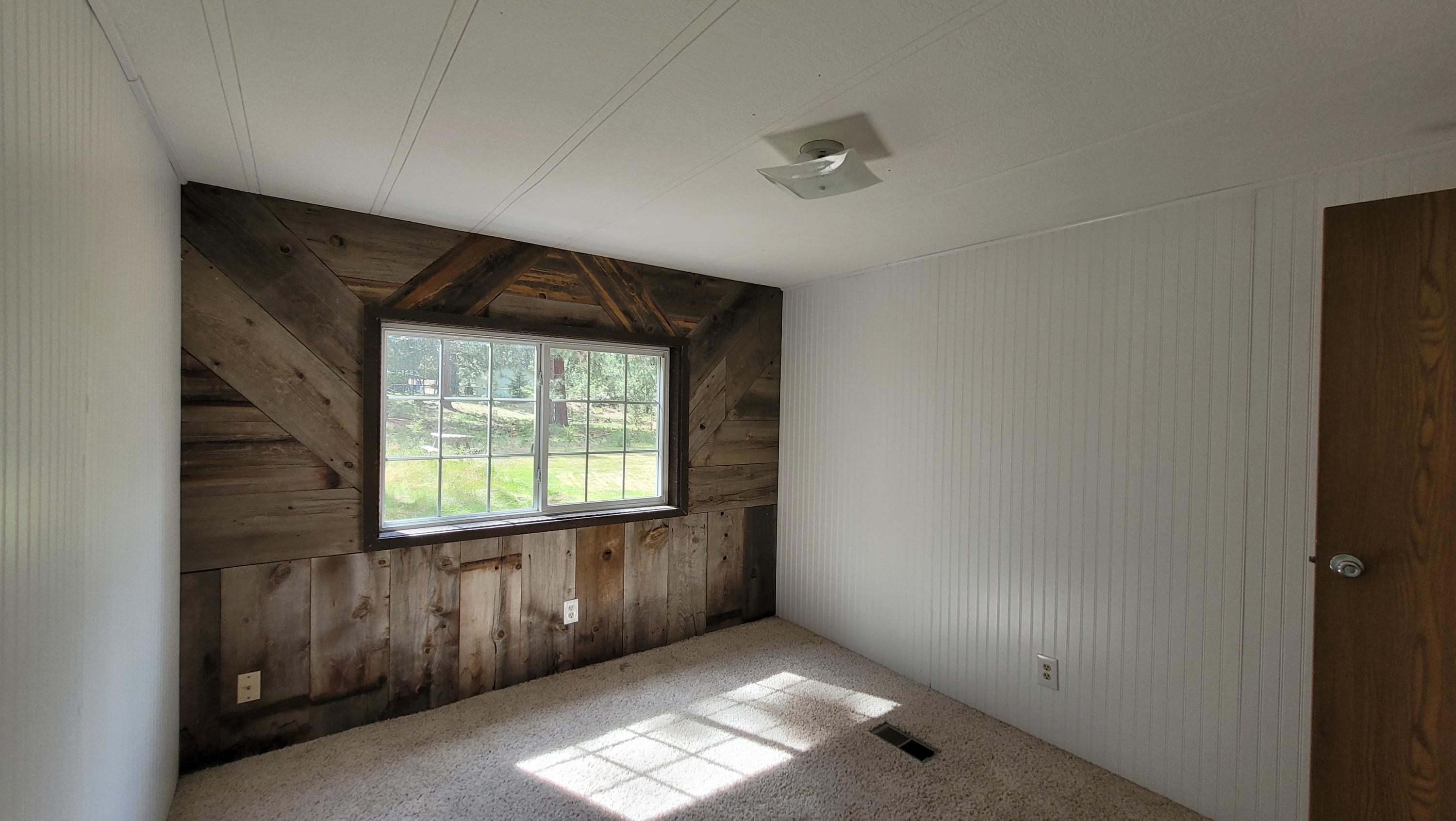 19724 Buck Canyon Road Bend, OR 97702 - Photo 22 of 38 2nd bedroom features reclaimed barn wood.