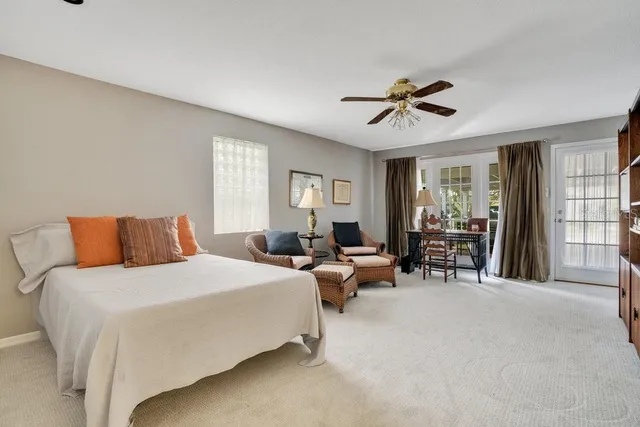 a bedroom with bed furniture and a window