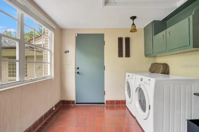 a view of a kitchen with washer and dryer
