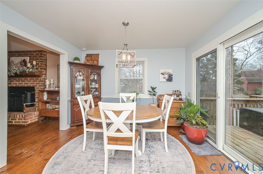 10217 Atlee Station Road Mechanicsville, VA 23116 - Photo 12 of 45 a dining room with wooden floor table and chairs