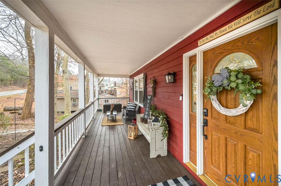 10217 Atlee Station Road Mechanicsville, VA 23116 - Photo 2 of 45 a view of a porch with wooden floor and iron stairs