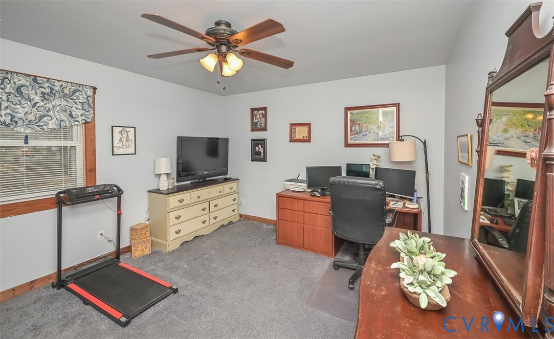 10217 Atlee Station Road Mechanicsville, VA 23116 - Photo 25 of 45 a living room with furniture and a flat screen tv