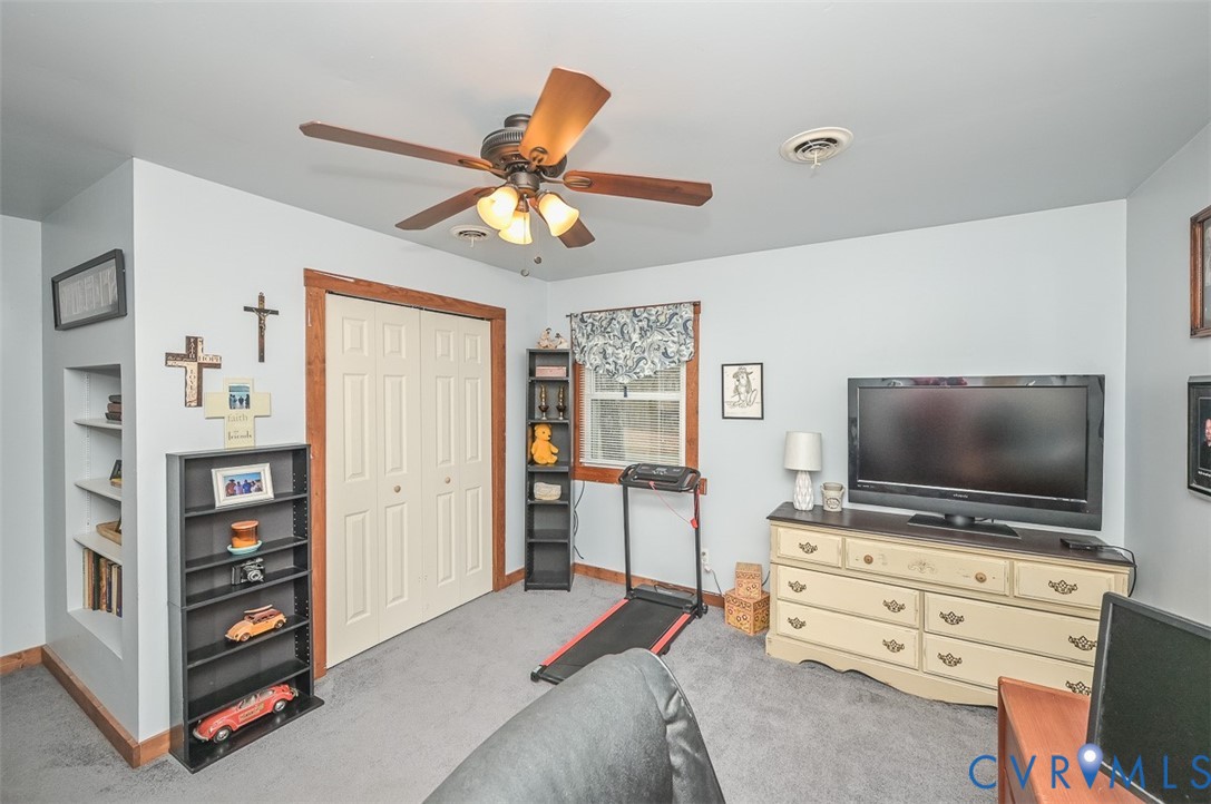 10217 Atlee Station Road Mechanicsville, VA 23116 - Photo 27 of 45 a room with furniture and a flat screen tv