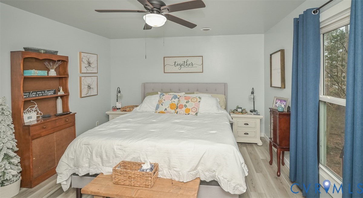10217 Atlee Station Road Mechanicsville, VA 23116 - Photo 29 of 45 a bedroom with a bed and a cabinets
