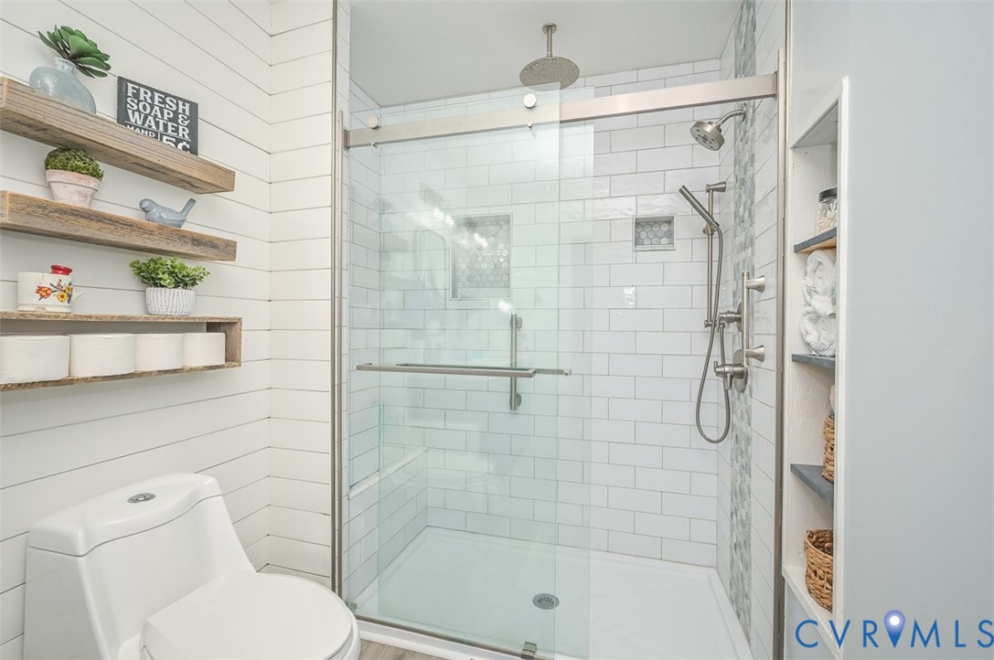 10217 Atlee Station Road Mechanicsville, VA 23116 - Photo 33 of 45 a bathroom with a shower and toilet