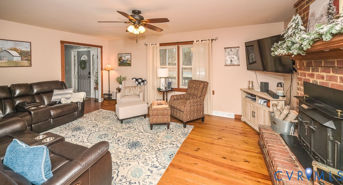 10217 Atlee Station Road Mechanicsville, VA 23116 - Photo 7 of 45 a living room with furniture and a flat screen tv