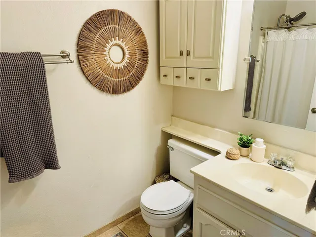 a bathroom with a toilet and a sink