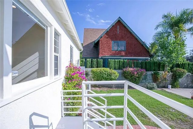 a view of backyard of house and green space
