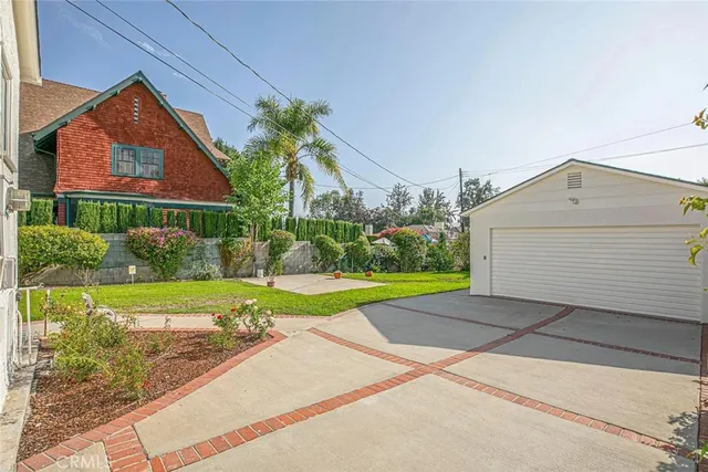 a view of a backyard with potted plants