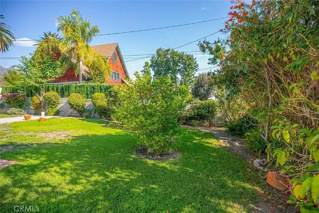 a backyard of a house with lots of green space