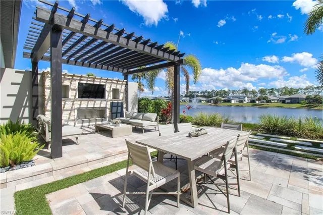 a view of a patio with swimming pool table and chairs