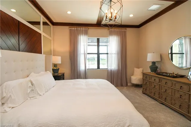 a spacious bedroom with a large bed and a dresser