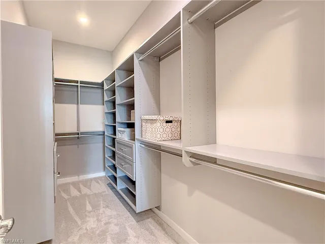 a view of an empty walk in closet