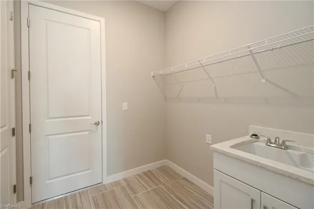 a bathroom with a sink and vanity