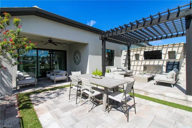 a view of an outdoor dining space with a patio