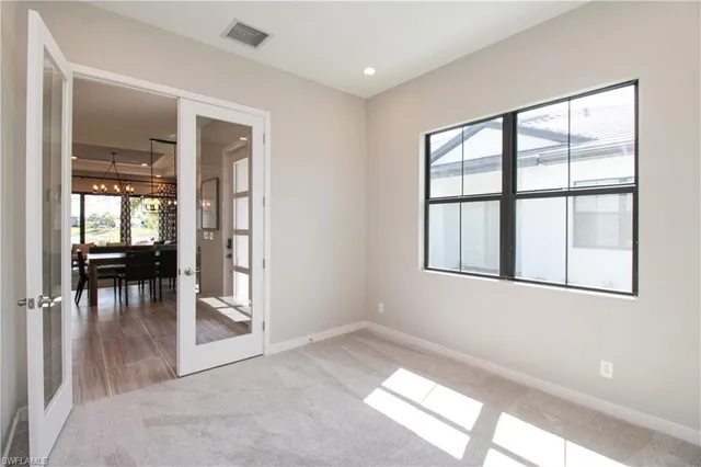 an empty room and windows