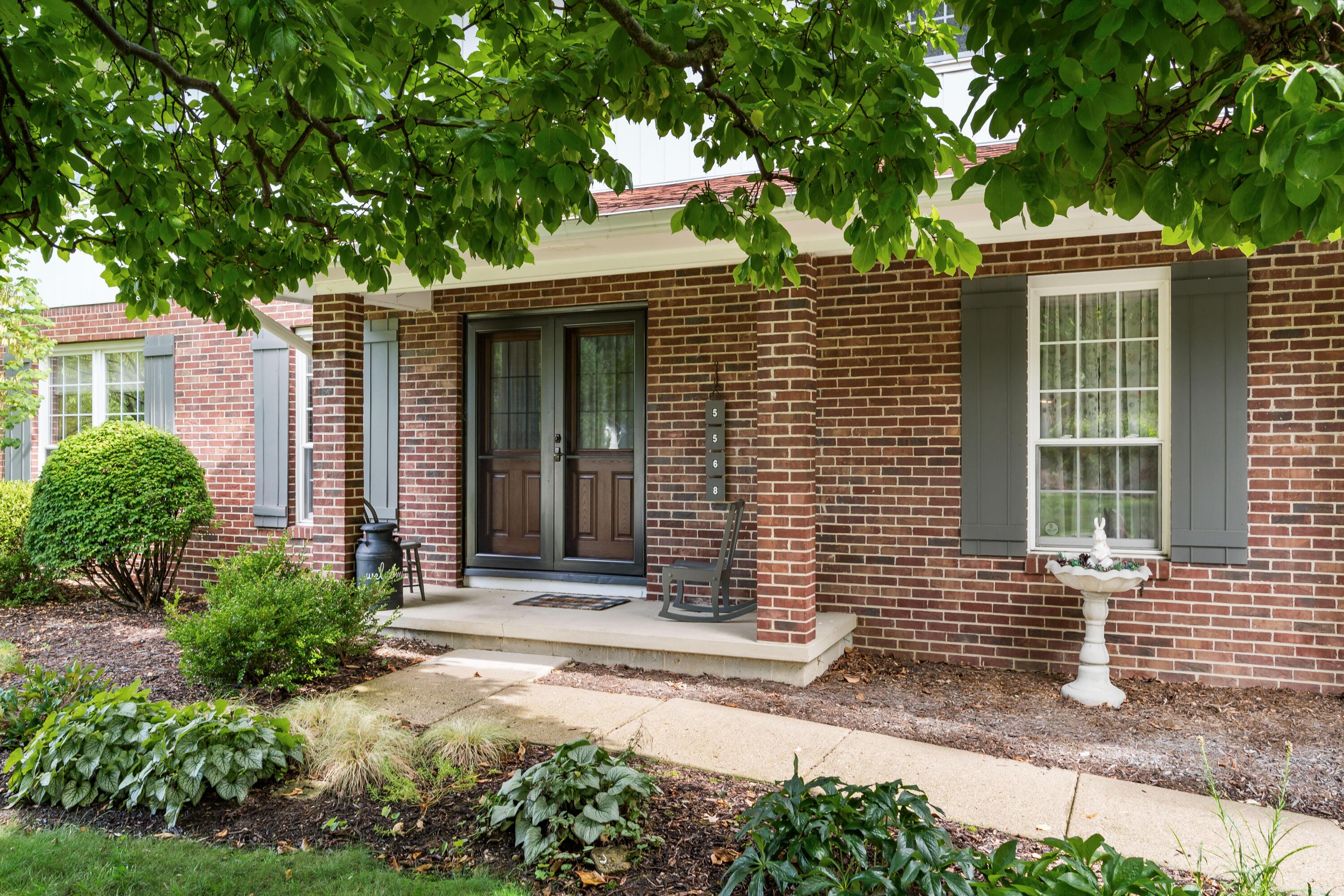 5568 Naiche Road Columbus, OH 43213 - Photo 3 of 42 Covered front porch, brick and siding exterior