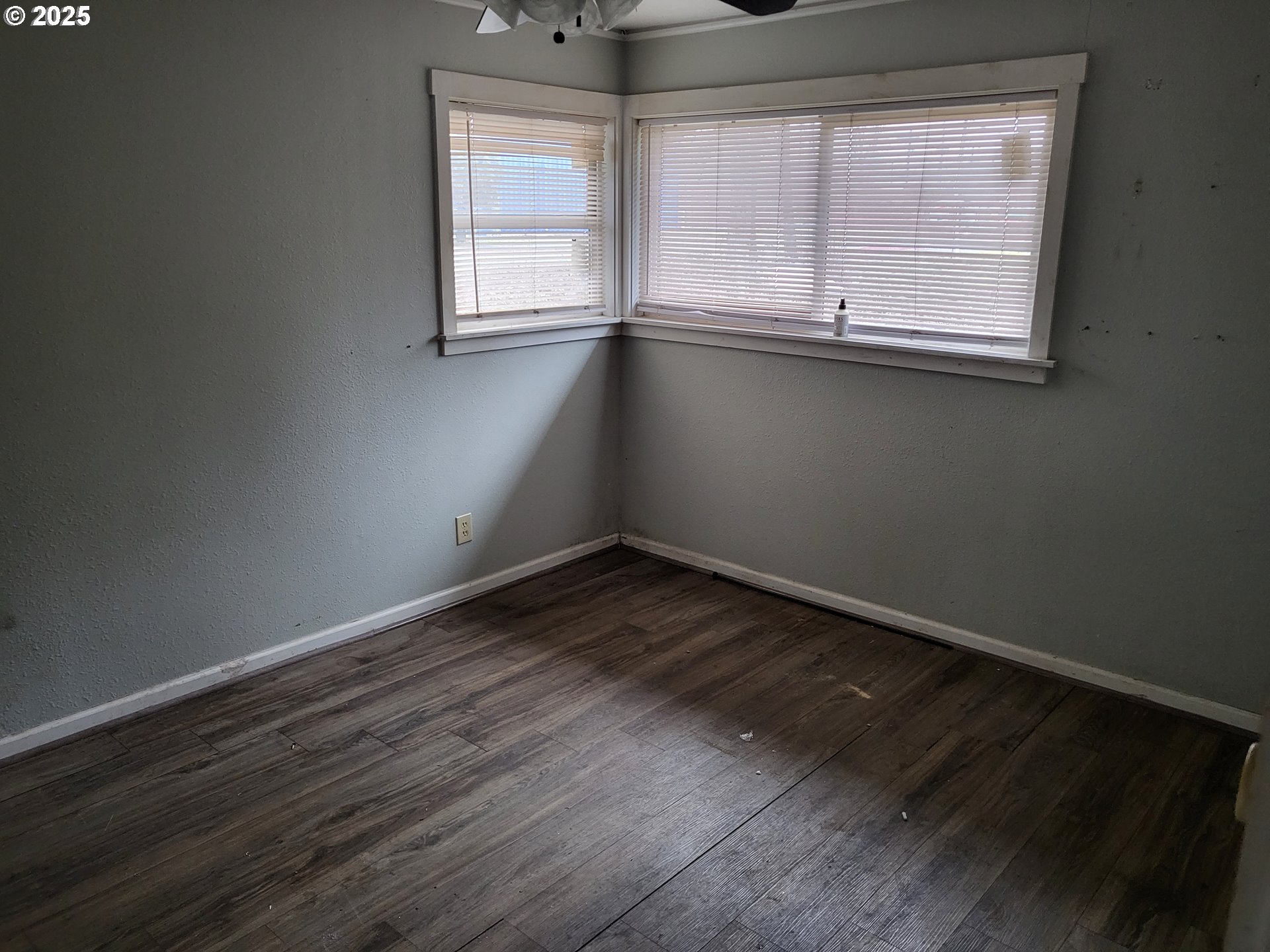 596 Northeast Linden Avenue Gresham, OR 97030 - Photo 11 of 18 an empty room with wooden floor and windows