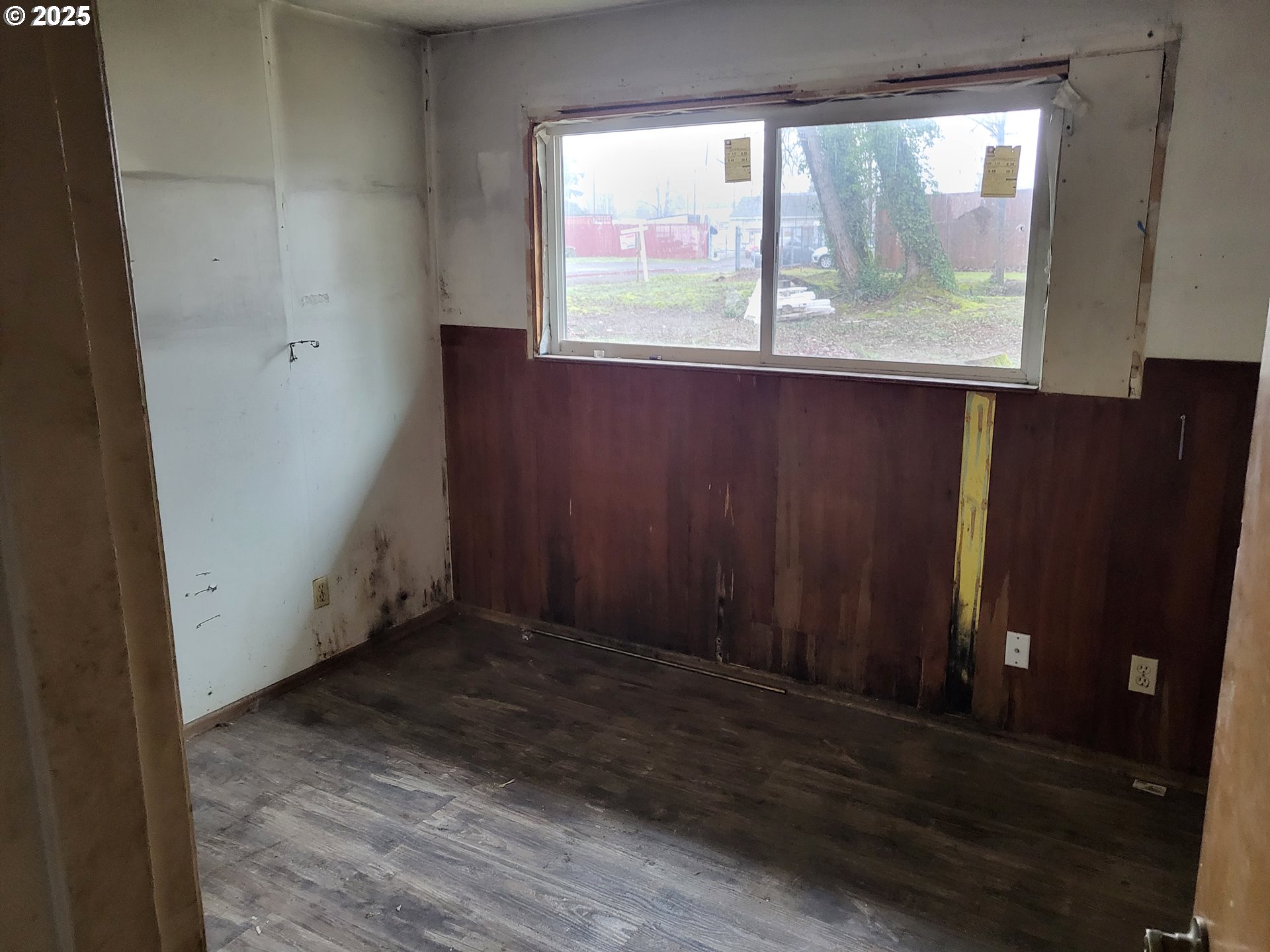596 Northeast Linden Avenue Gresham, OR 97030 - Photo 14 of 18 an empty room with wooden floor and windows