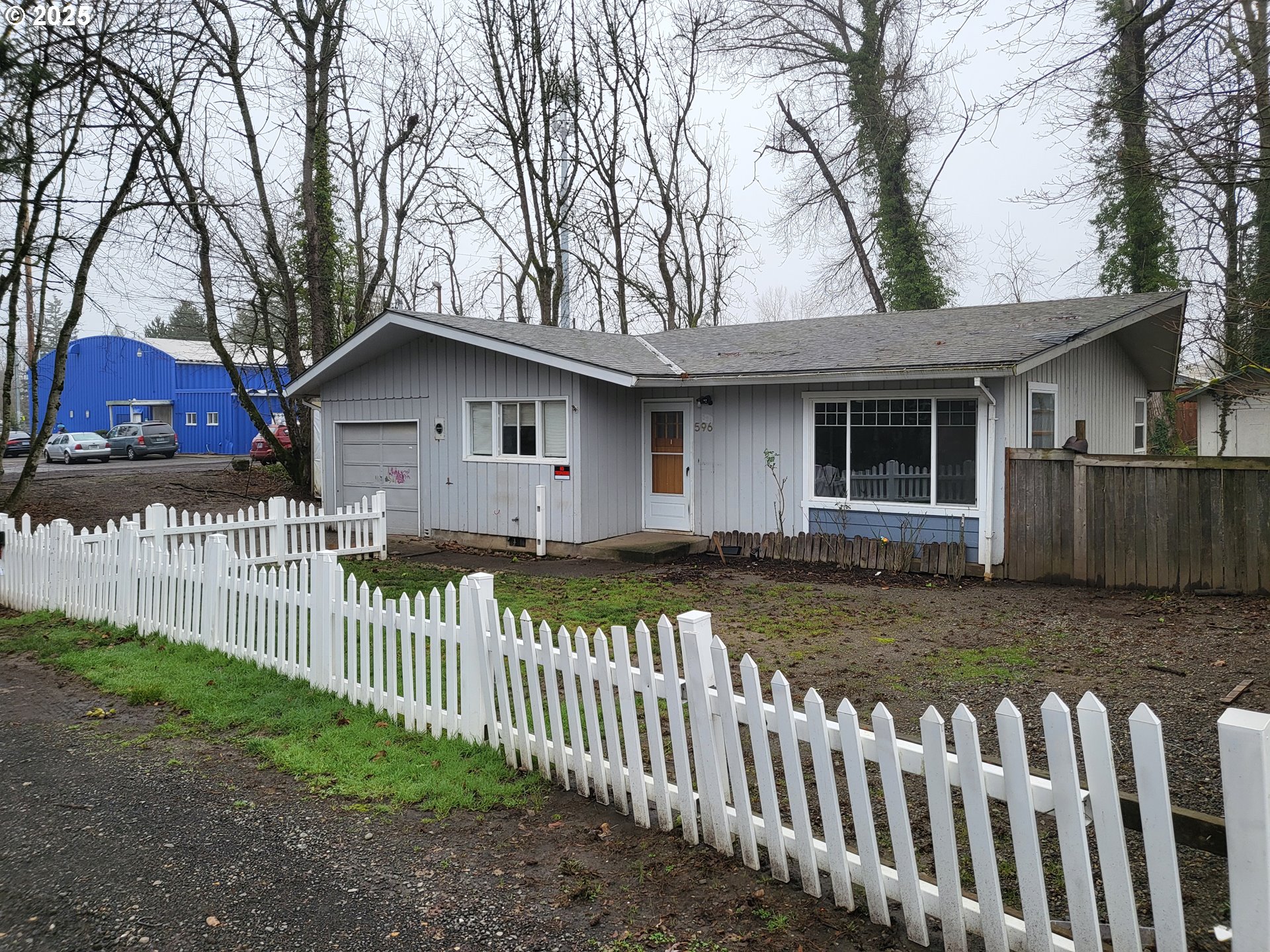 596 Northeast Linden Avenue Gresham, OR 97030 - Photo 2 of 18 a front view of a house with a yard