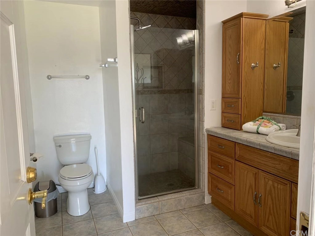 5053 Roundup Road Norco, CA 92860 - Photo 23 of 71 master bathroom with shower and toilet