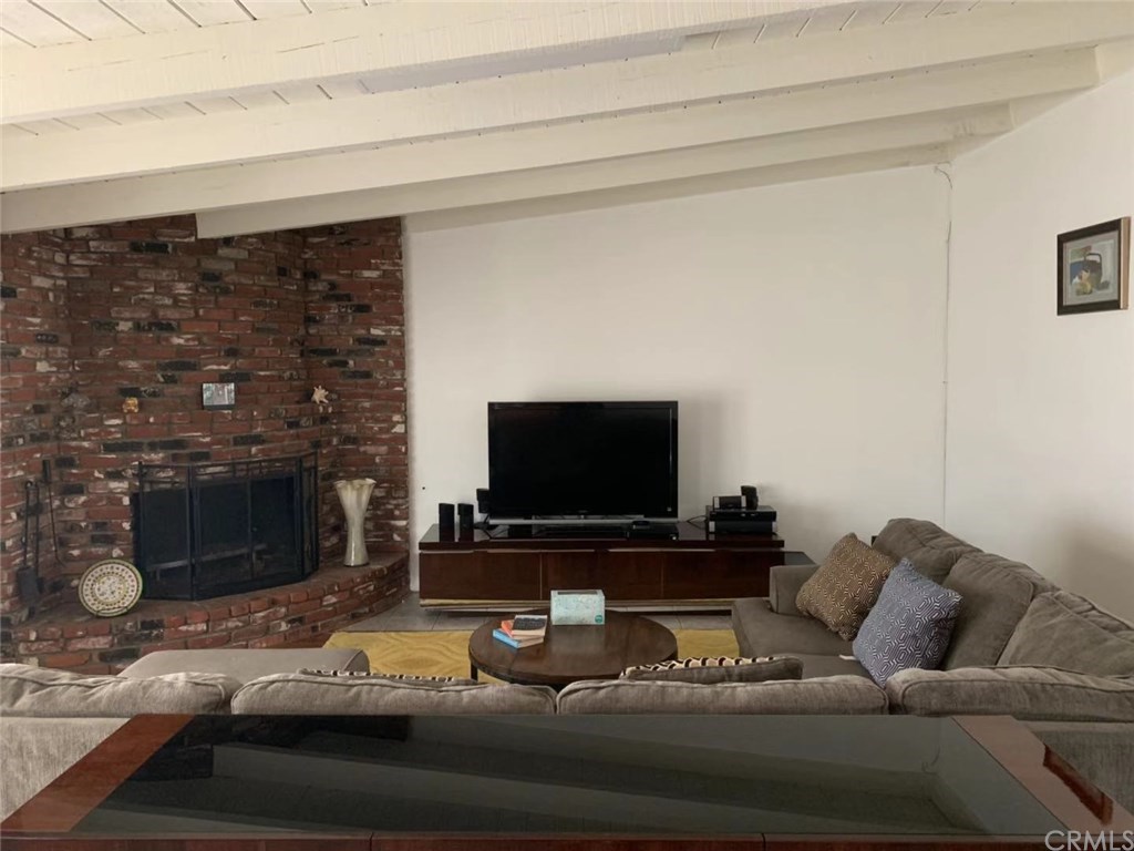 5053 Roundup Road Norco, CA 92860 - Photo 6 of 71 living room with brick fireplace