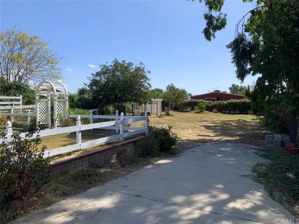 5053 Roundup Road Norco, CA 92860 - Photo 53 of 71 long driveway in the backyard