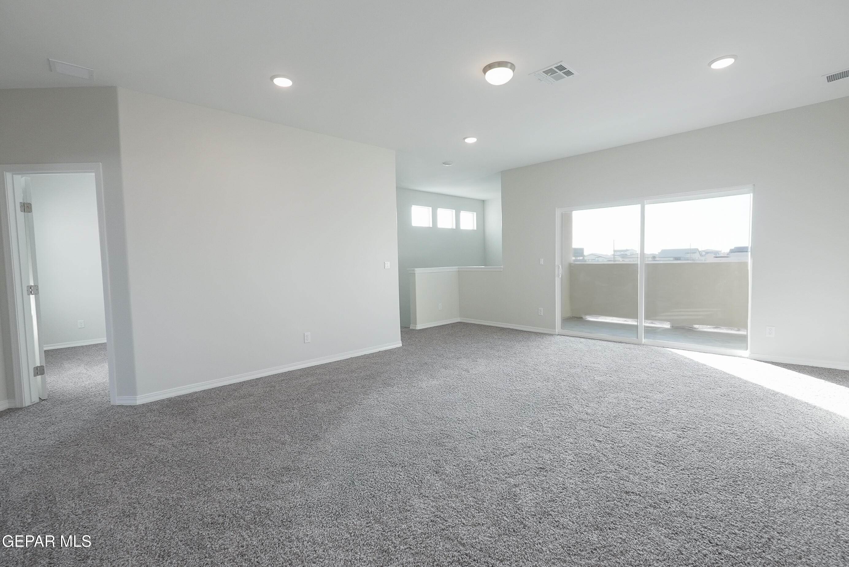 12436 Fill Ball Street El Paso, TX 79928 - Photo 13 of 31 a view of an empty room with a window