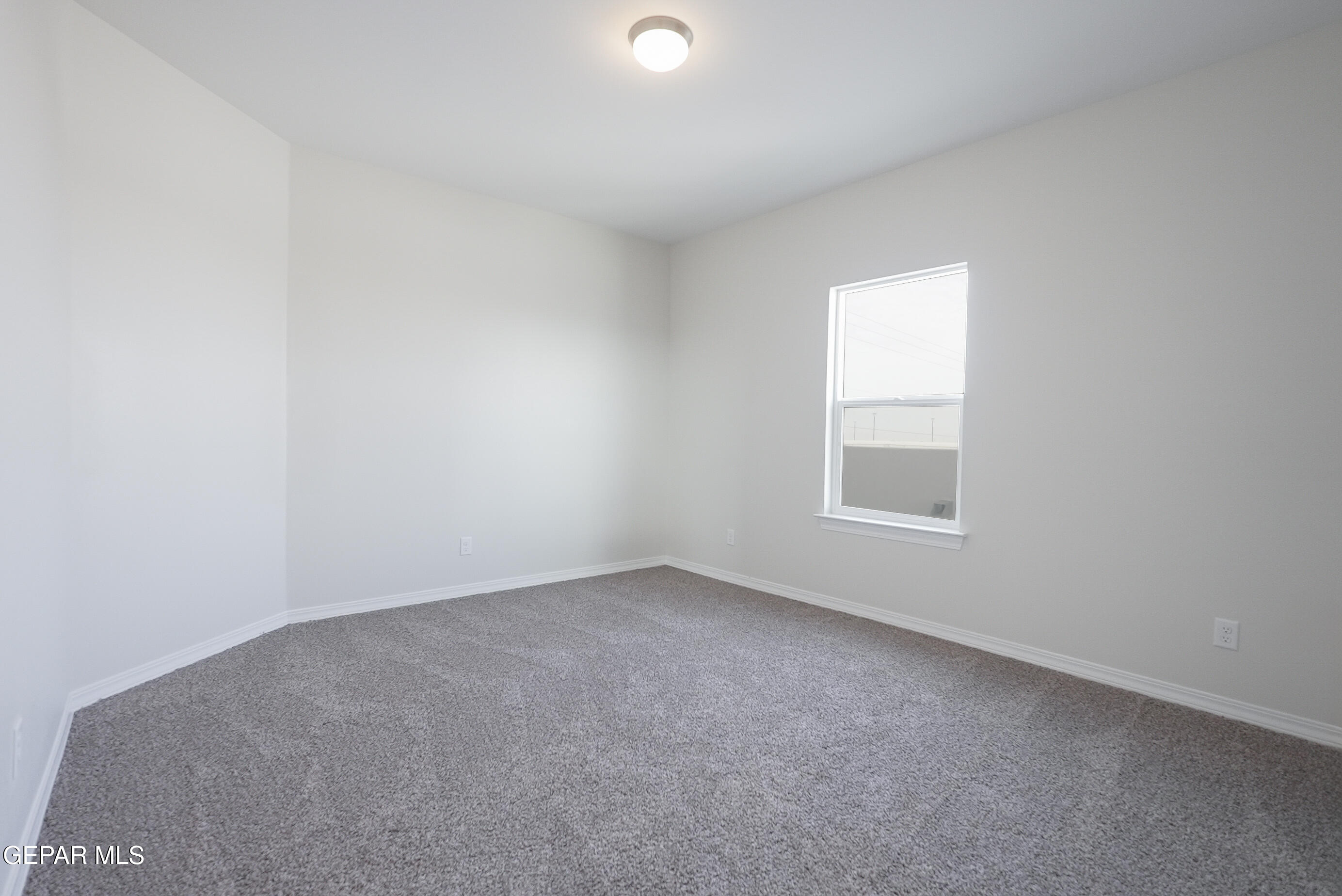 12436 Fill Ball Street El Paso, TX 79928 - Photo 17 of 31 an empty room with a window