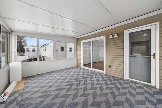 a big room with wooden floor and windows