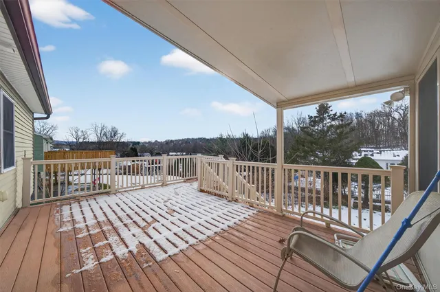 a view of balcony with deck and wooden floor