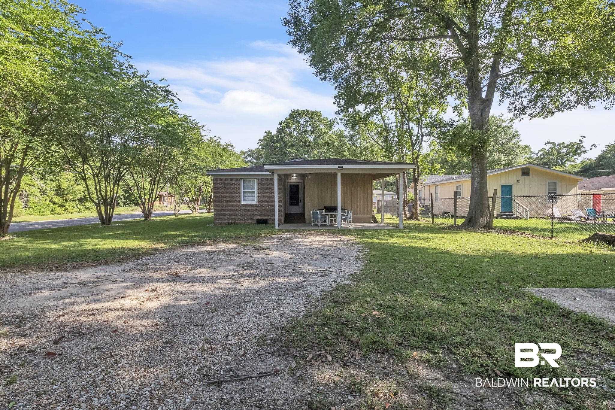 315 Fourth Avenue Chickasaw, AL 36611 - Photo 7 of 28 Bungalow-style home with fence and a front lawn