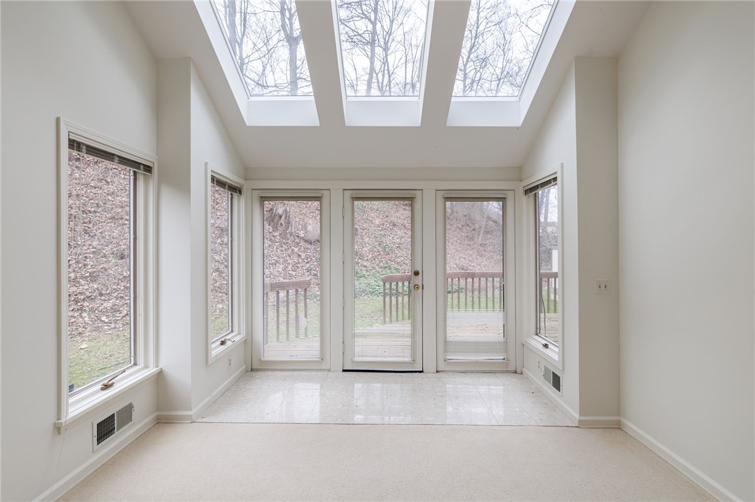 223 Highland Parkway Rochester, NY 14620 - Photo 9 of 29 Lovely sunroom "area" leading out to the deck