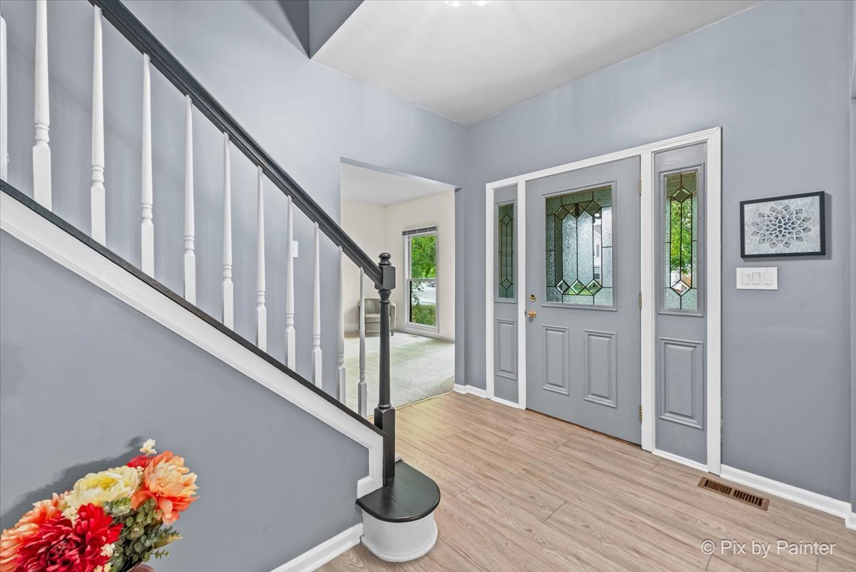 1820 Crofton Drive Algonquin, IL 60102 - Photo 12 of 60 a view of entryway with wooden floor and stairs