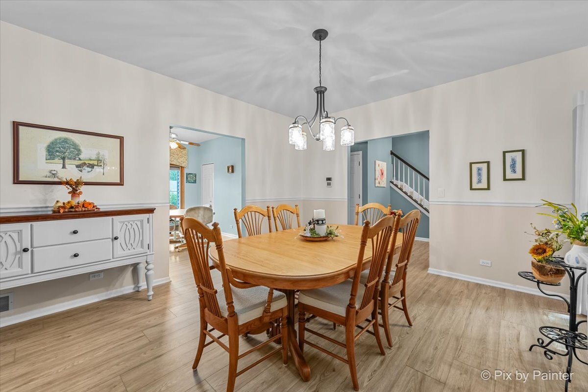 1820 Crofton Drive Algonquin, IL 60102 - Photo 16 of 60 a view of a dining room with furniture and wooden floor