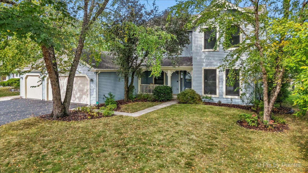 1820 Crofton Drive Algonquin, IL 60102 - Photo 2 of 60 a front view of a house with a yard