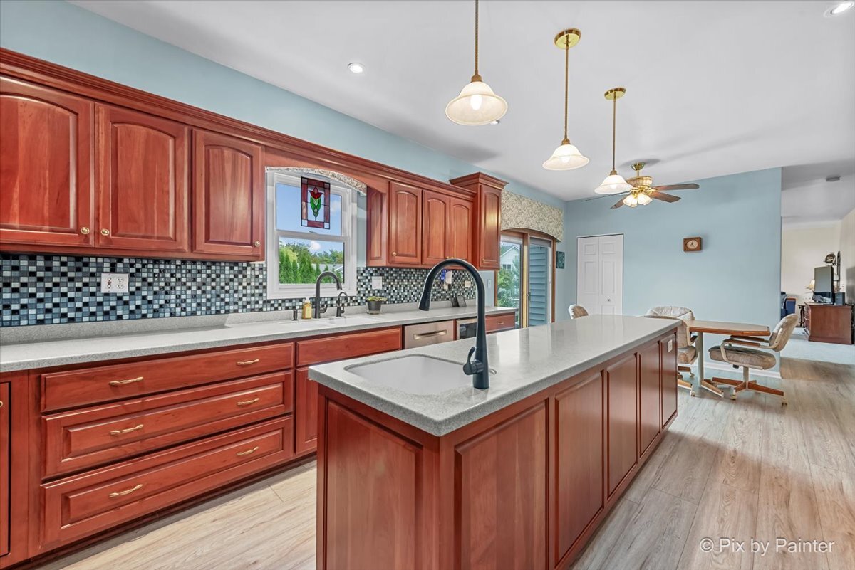1820 Crofton Drive Algonquin, IL 60102 - Photo 23 of 60 a kitchen with a sink a counter space appliances and cabinets