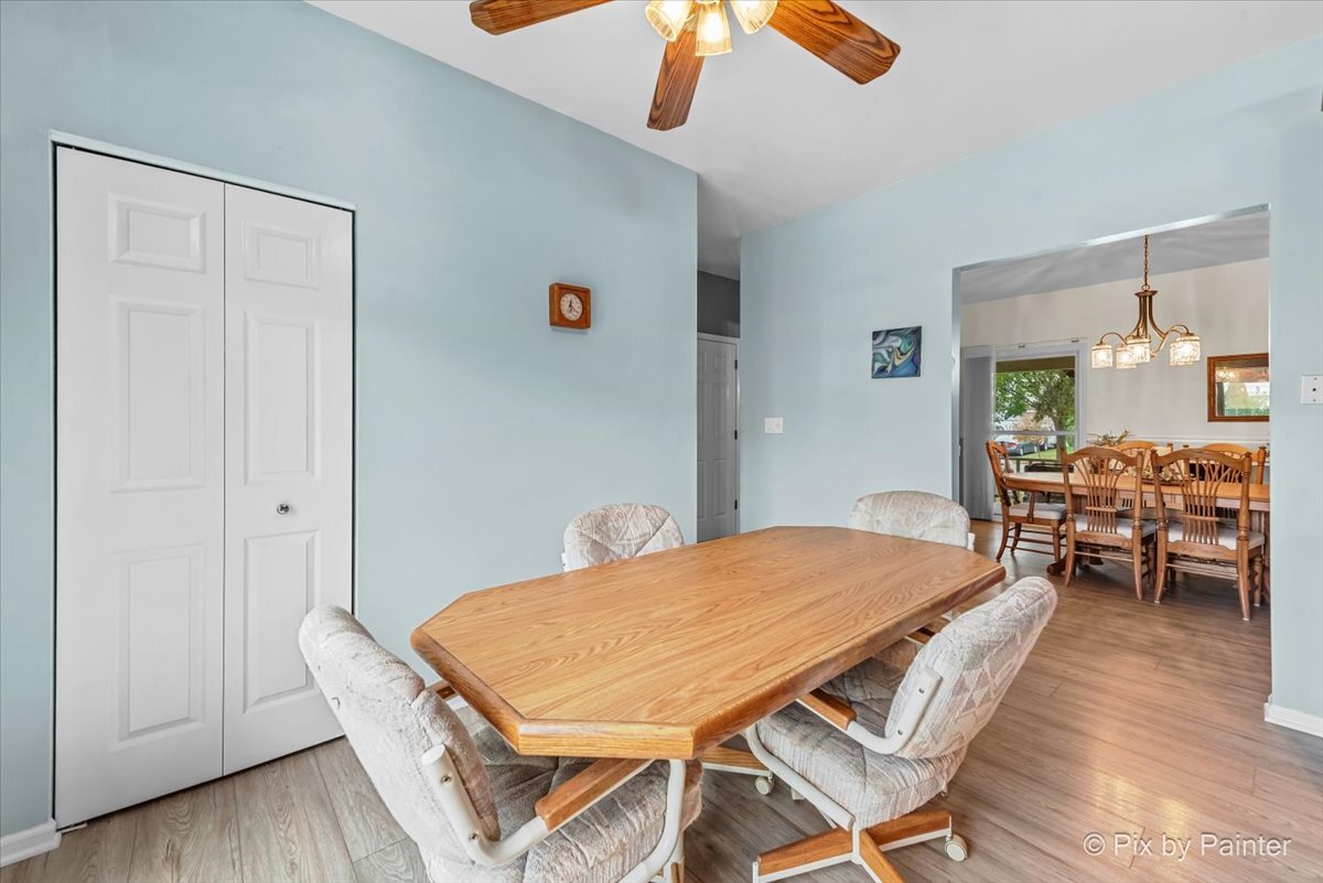 1820 Crofton Drive Algonquin, IL 60102 - Photo 24 of 60 a view of a dining room with furniture and wooden floor