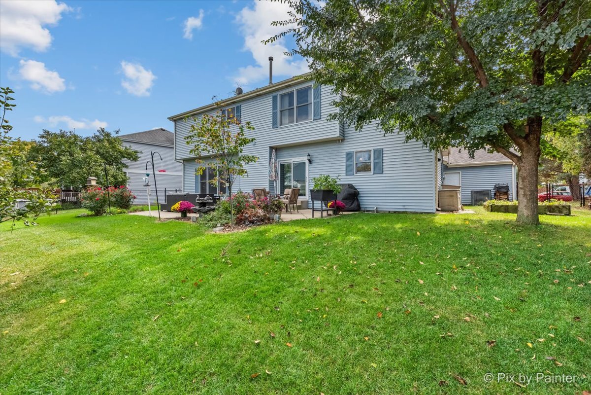 1820 Crofton Drive Algonquin, IL 60102 - Photo 46 of 60 a front view of house with yard and green space