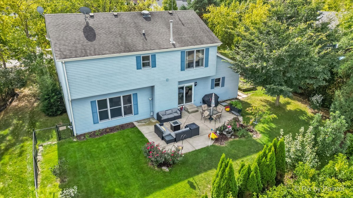 1820 Crofton Drive Algonquin, IL 60102 - Photo 48 of 60 a aerial view of a house with a yard table and chairs
