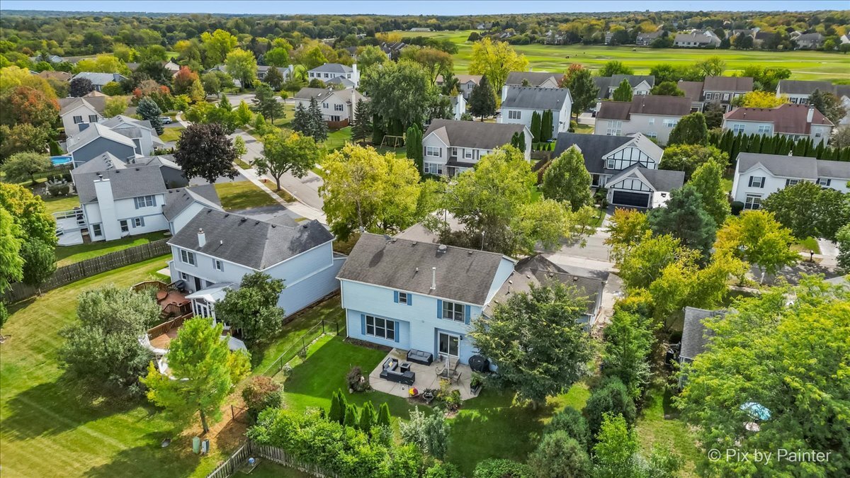 1820 Crofton Drive Algonquin, IL 60102 - Photo 56 of 60 an aerial view of residential houses with outdoor space and swimming pool