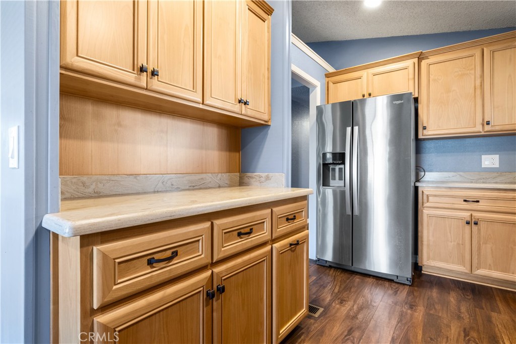 1220 Bennett Way, Unit 1 Templeton, CA 93465 - Photo 14 of 37 a kitchen with granite countertop a refrigerator stove and wooden floor