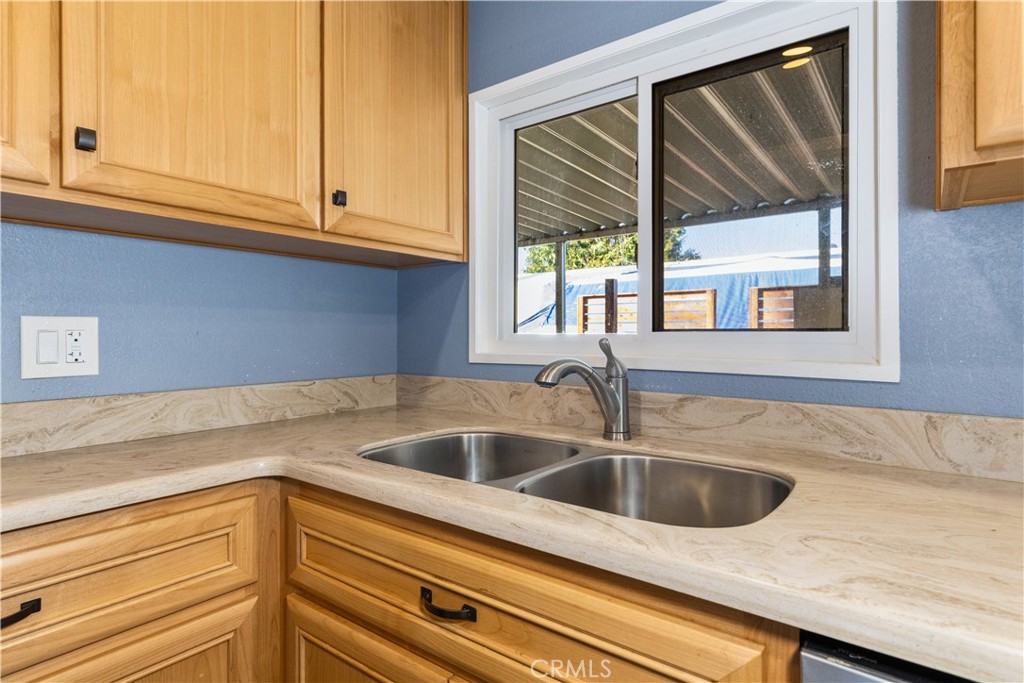 1220 Bennett Way, Unit 1 Templeton, CA 93465 - Photo 17 of 37 a kitchen with granite countertop a sink and a window