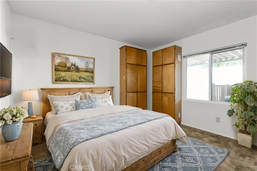 1220 Bennett Way, Unit 1 Templeton, CA 93465 - Photo 20 of 37 a bedroom with a bed and a window